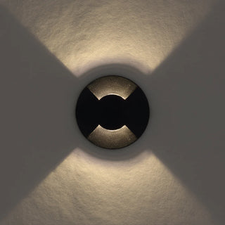 Telbix Raker 24V 2 way inground light illuminated on outdoor wall