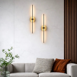 Pair of Rimini travertine wall lights installed above a modern sofa