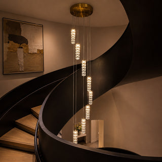 Modern crystal staircase chandelier hanging in luxury spiral staircase void with warm LED lighting