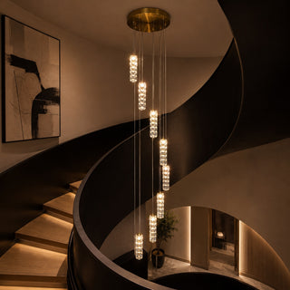 Luxury multi drop crystal pendant installed in modern staircase void for double height home entry