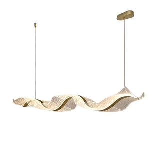 Wave-shaped pendant light with gold finish on a plain background