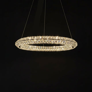 Crystal chandelier hanging against a black curtain
