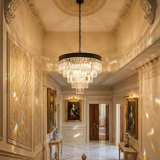Cascata crystal pendant suspended above a staircase of a luxuriosly appointed house