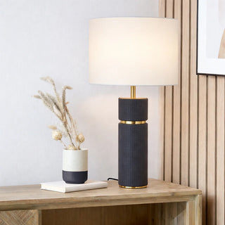 Telbix Valda black table lamp styled on timber console with ivory fabric shade