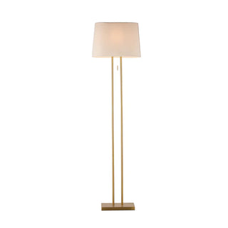 Tall indoor floor lamp with brass base and ivory shade