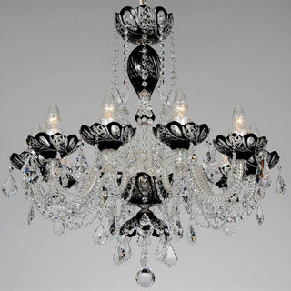 A multi-arm crystal chandelier with black metal accents and hanging clear glass teardrop prisms, shown against a plain light gray background.