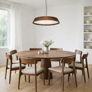 Havit Noyer walnut timber LED pendant light centred above round walnut dining table with six Scandinavian style chairs