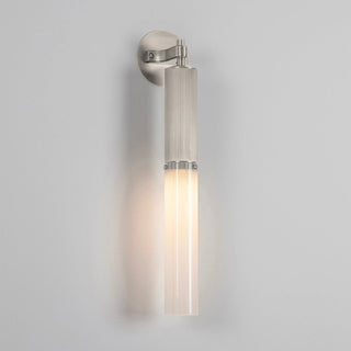 Wall-mounted light fixture on a gray background