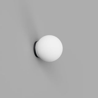 Spherical wall light fixture on a gray background