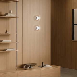 Pair of Orb Artisan Wall Lights installed in contemporary living room interior