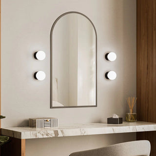 Multiple Orb Deco Wall Lights installed around decorative mirror in luxury interior