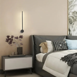 Obia black 60cm LED wall light installed beside bed in modern bedroom